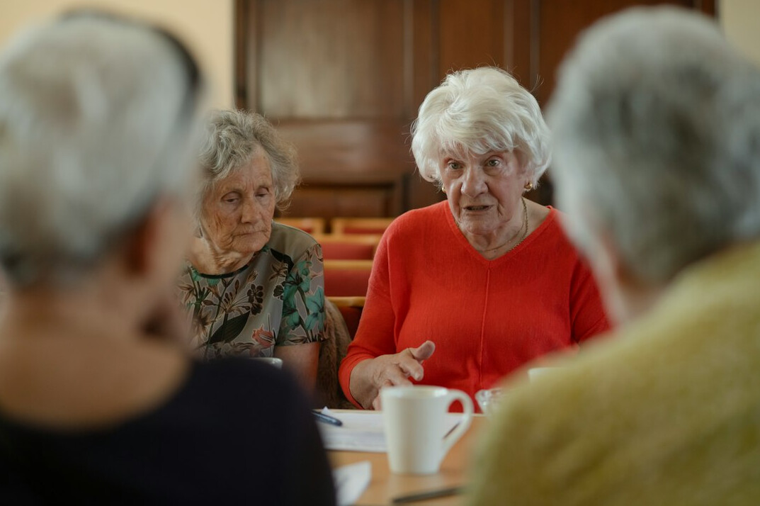 group of elderly women talking